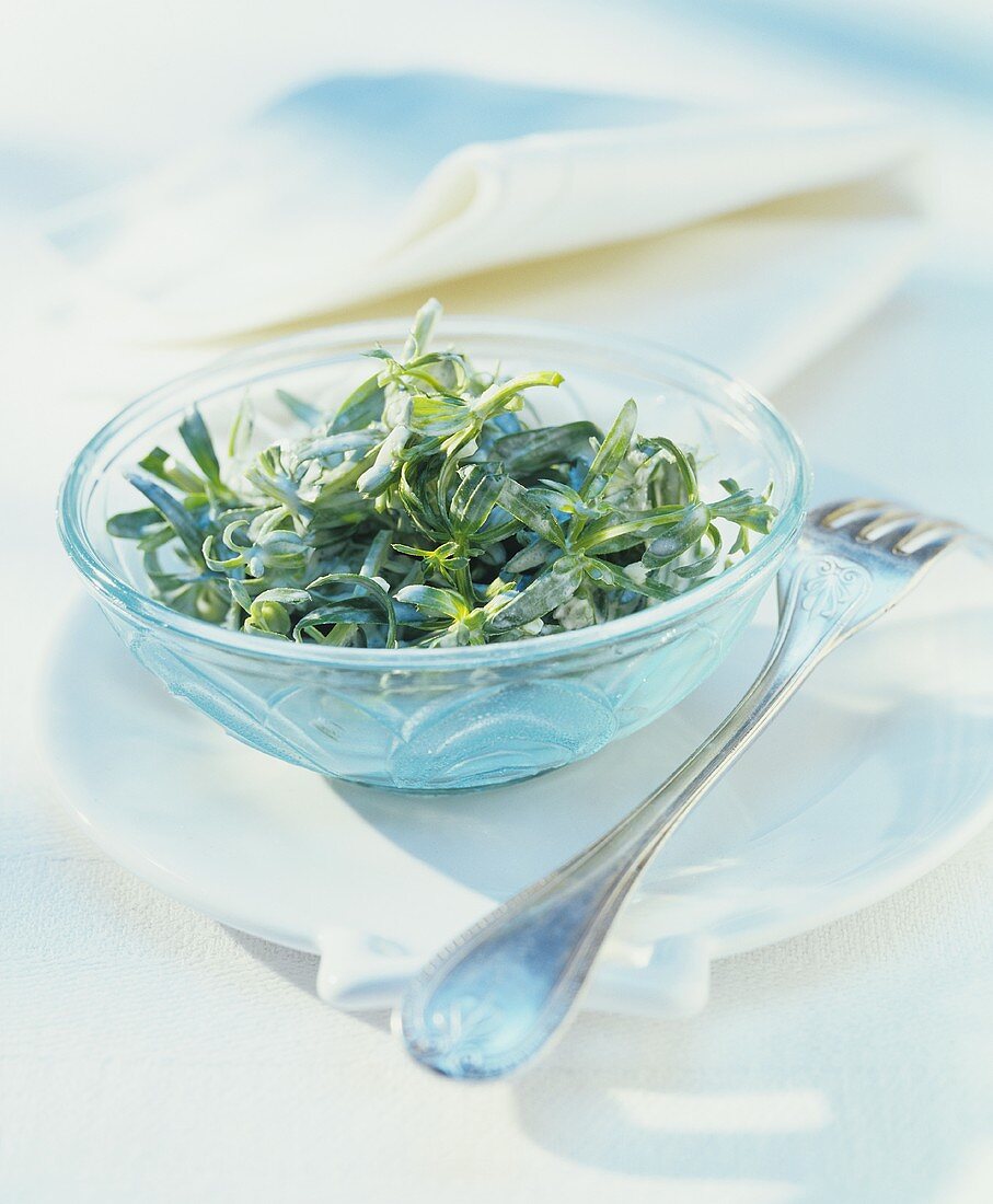 Hedge bedstraw salad in a glass bowl