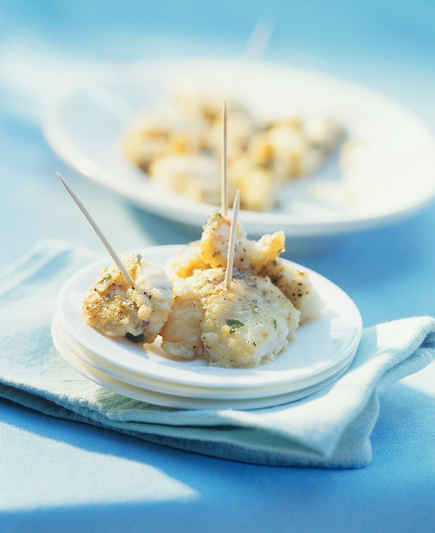 Fried cod appetisers on cocktail sticks