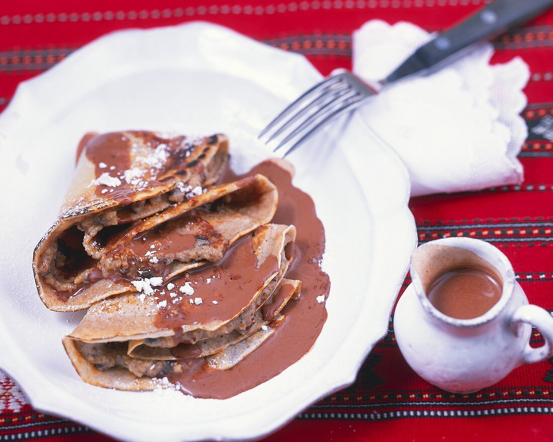 Nut pancakes with chocolate sauce