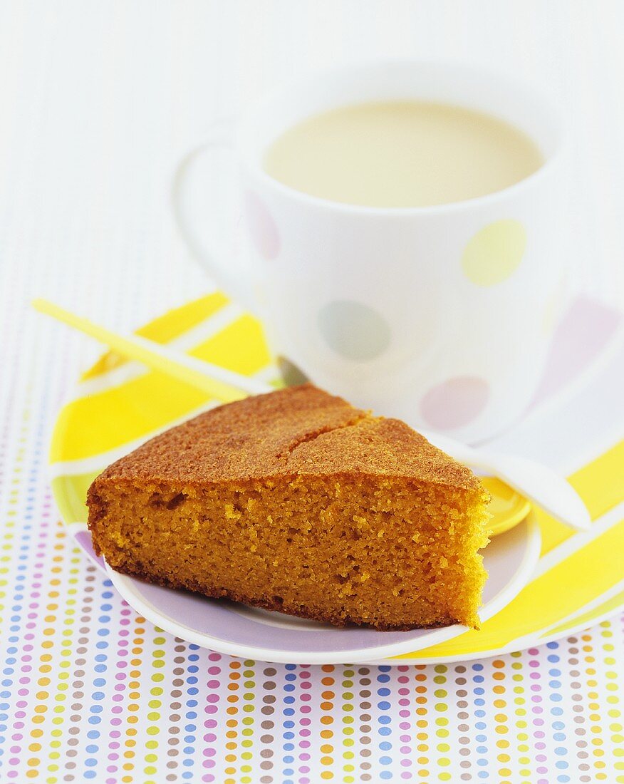 A piece of carrot cake with tea