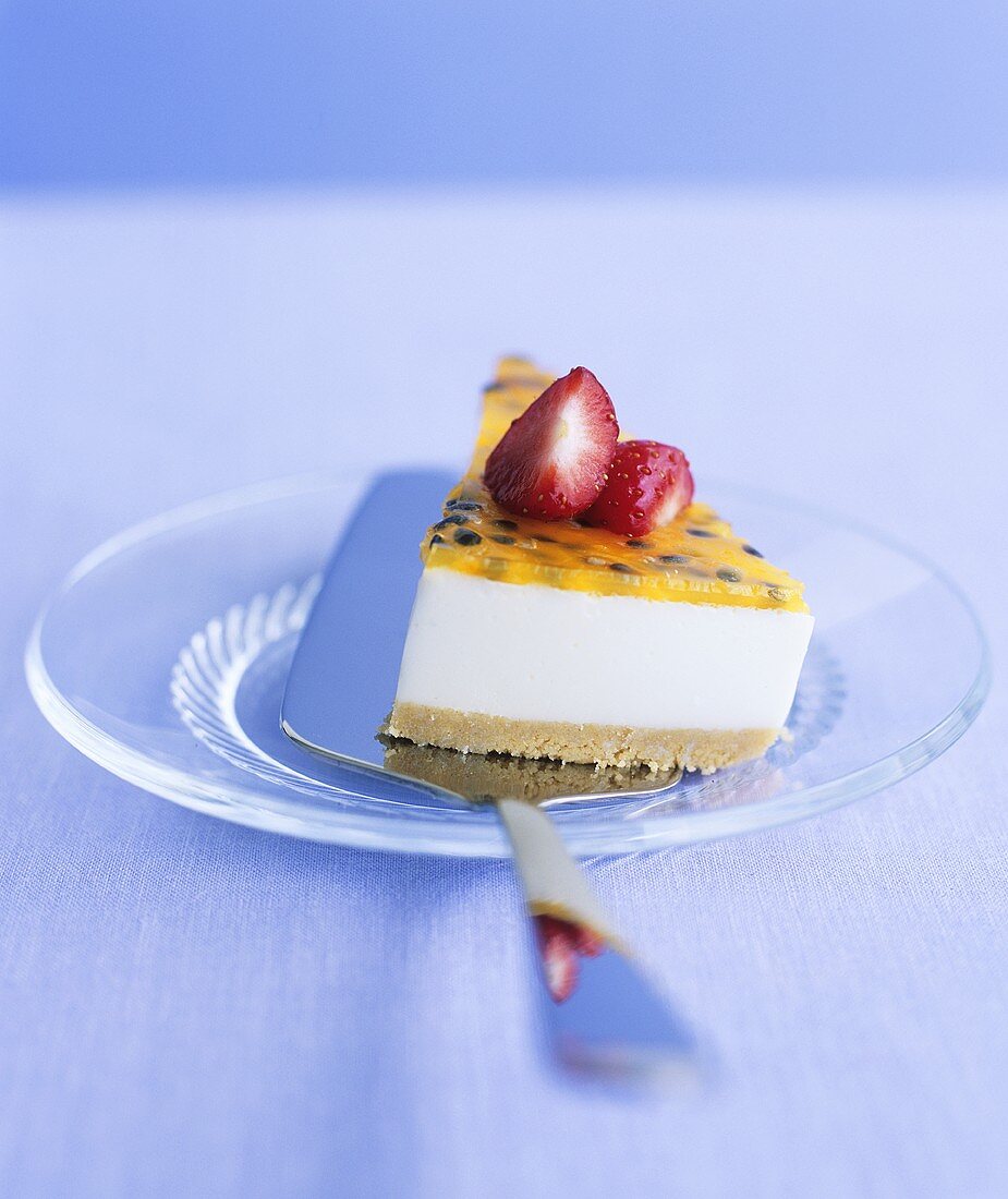 A piece of passion fruit and strawberry cheesecake