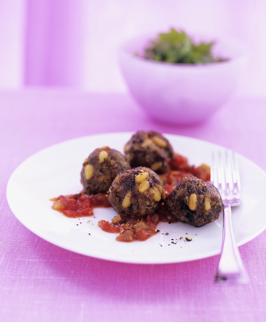 Moroccan meatballs with pine nuts, tomato sauce