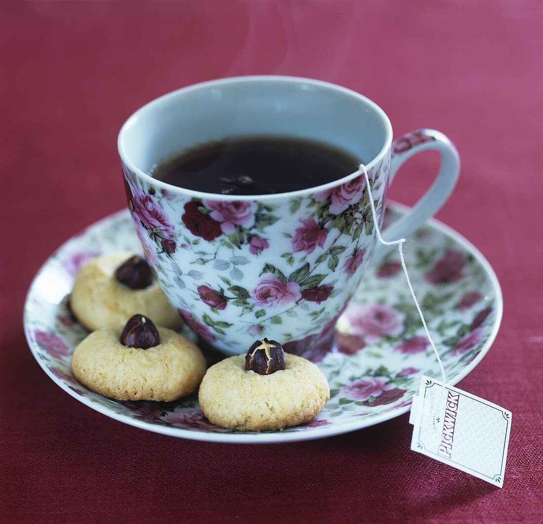 A cup of tea with biscuits