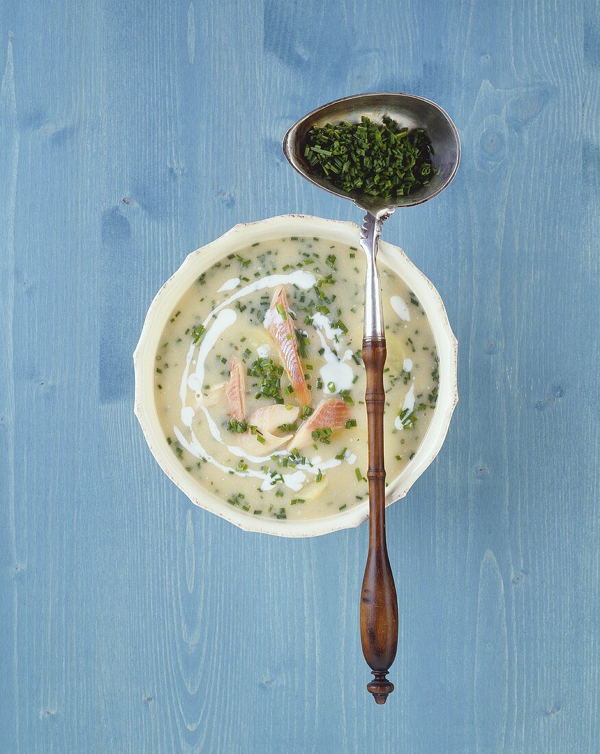 Potato soup with smoked fish and chives