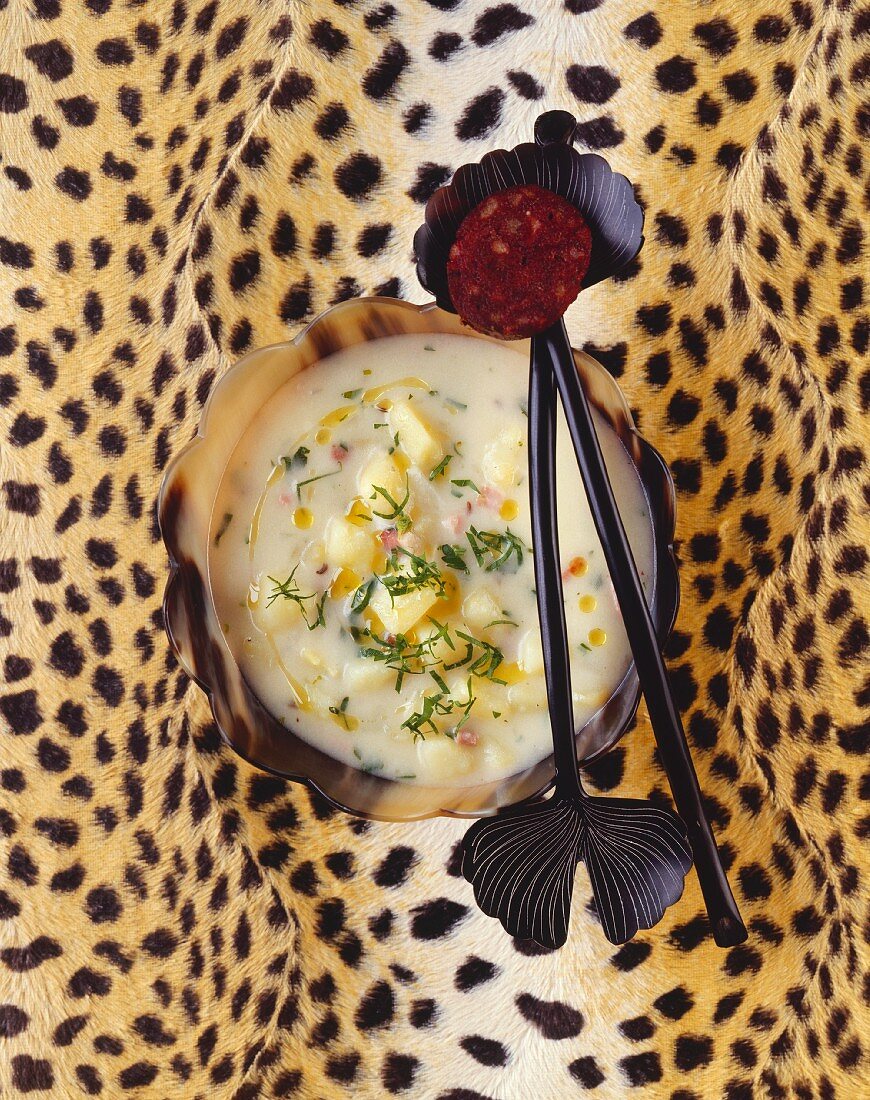 Potato soup with black pudding on cheetah skin