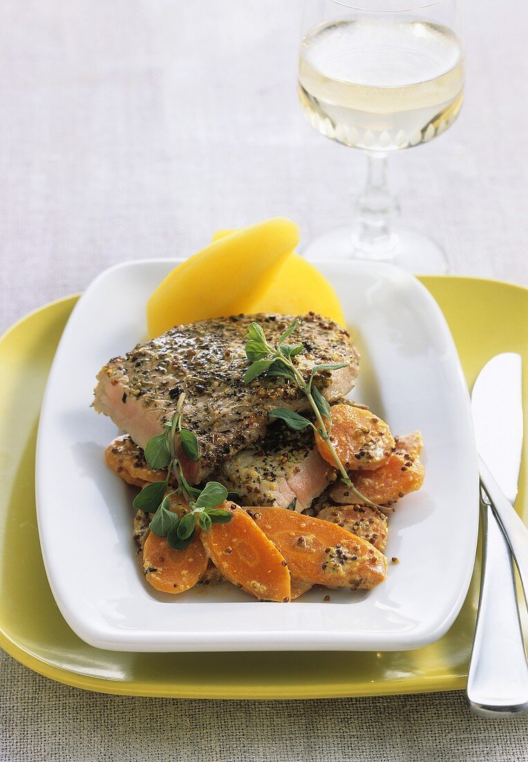 Loin of veal with mustard crust, carrots and potatoes