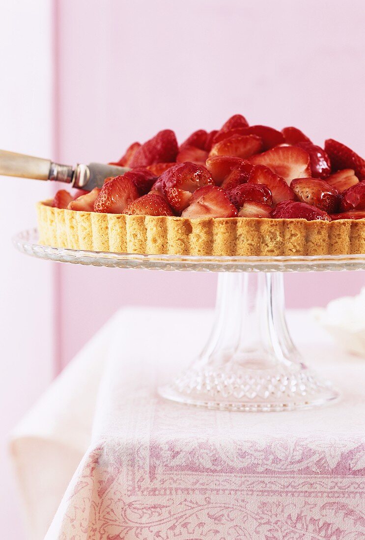 Strawberry tart on cake stand