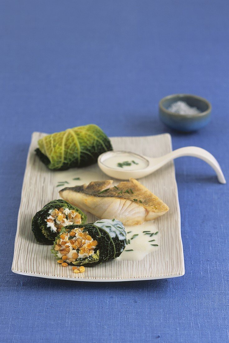 Fried zander with stuffed savoy cabbage leaves