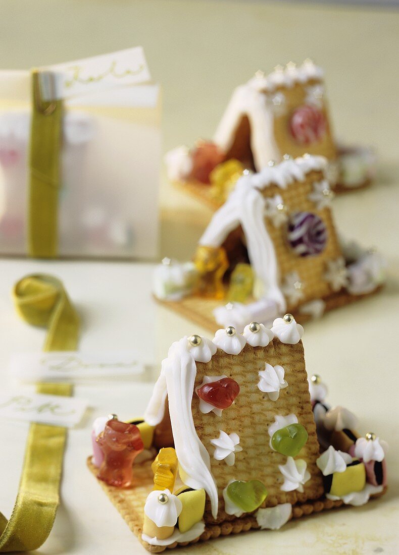 Gingerbread houses made with biscuits and decorated with jelly sweets
