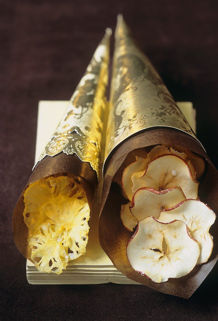 Baby pineapple and apple crisps in golden cones (to give as gifts)