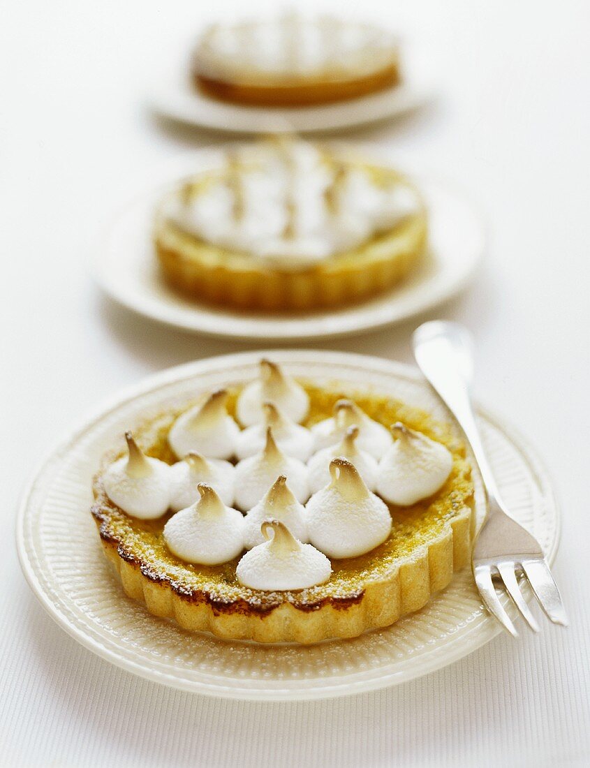 Three tarts with meringue topping