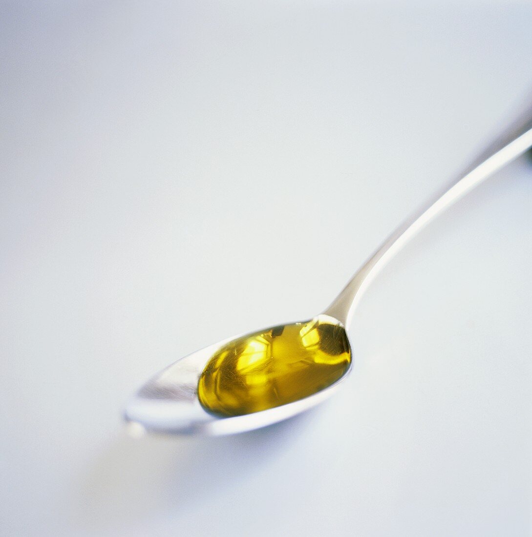 Olive oil in spoon