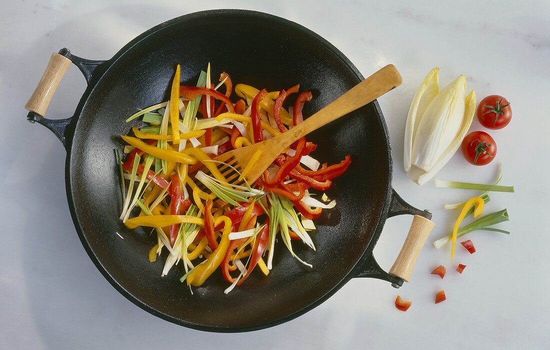 Frying vegetables gently in a wok