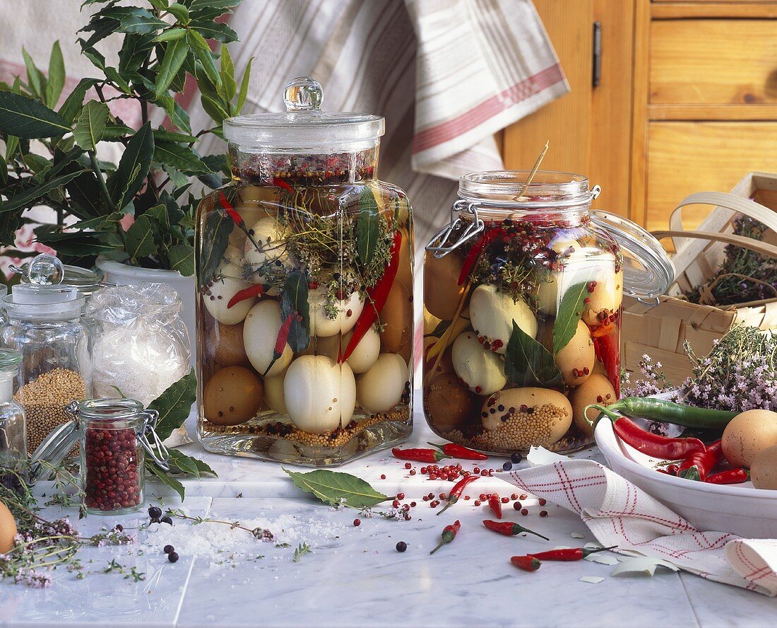 Pickled eggs in preserving jars with spices