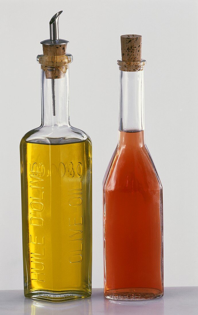 Bottle of raspberry vinegar and bottle of olive oil