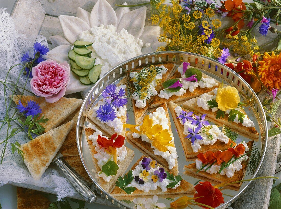Quark and edible flowers on toast triangles