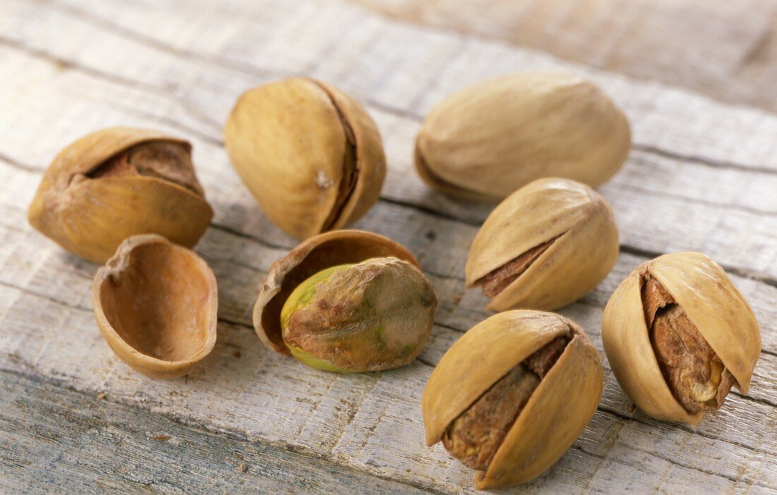 Pistachios on wooden background