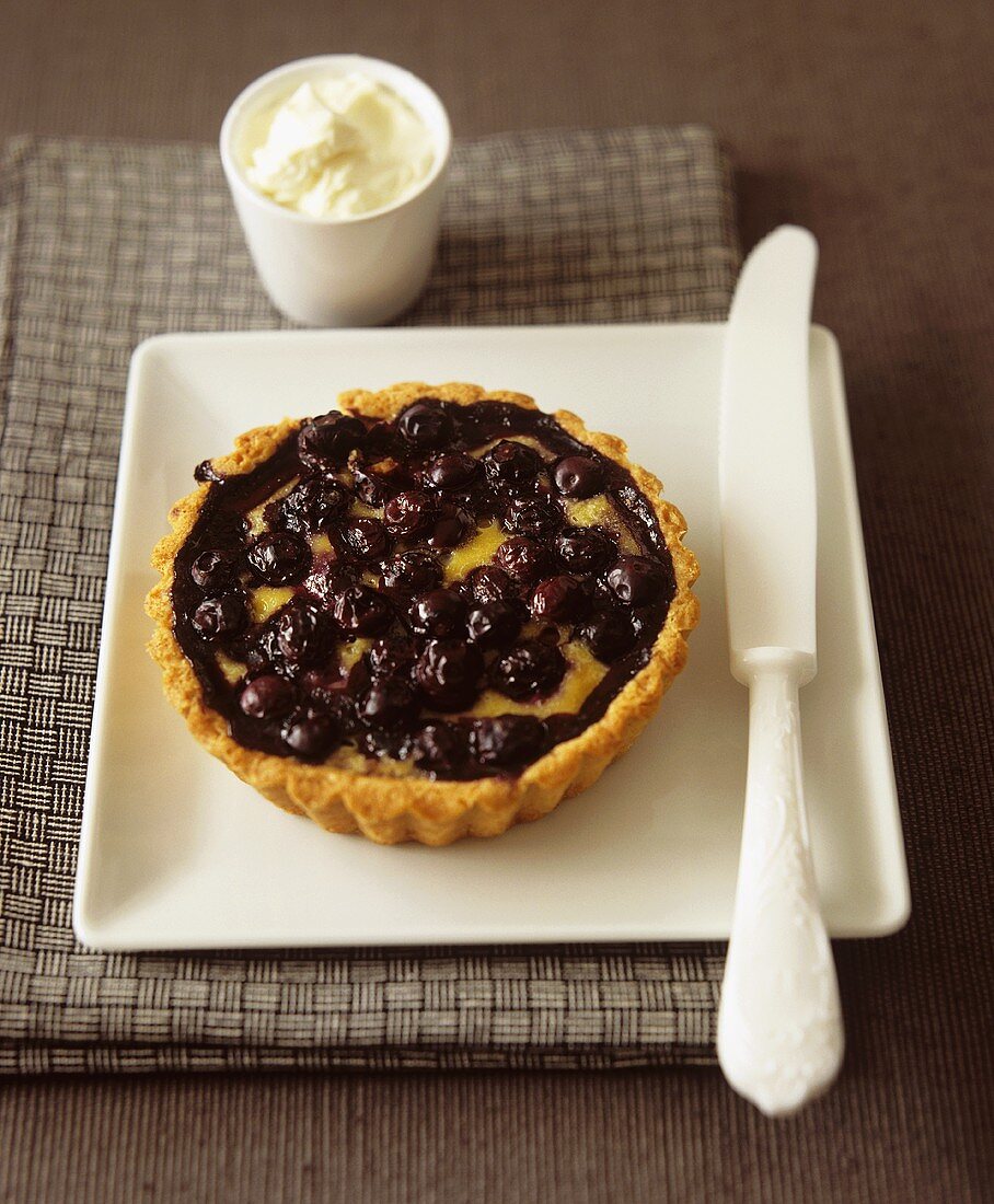 Cherry tart with whipped cream