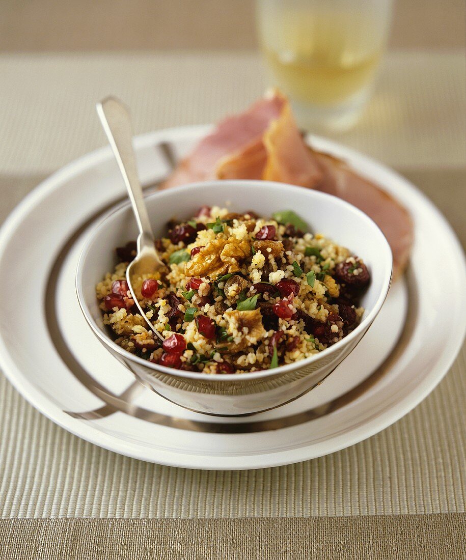Couscous salad with fruit and nuts, ham