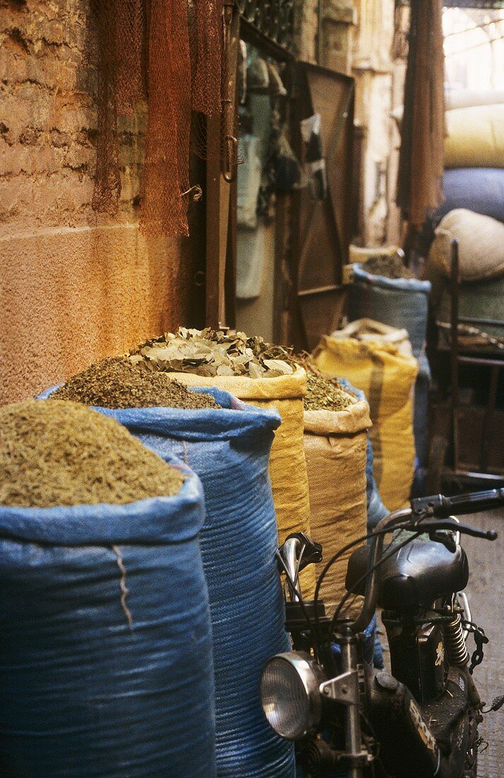 Sacks of dried herbs at a market