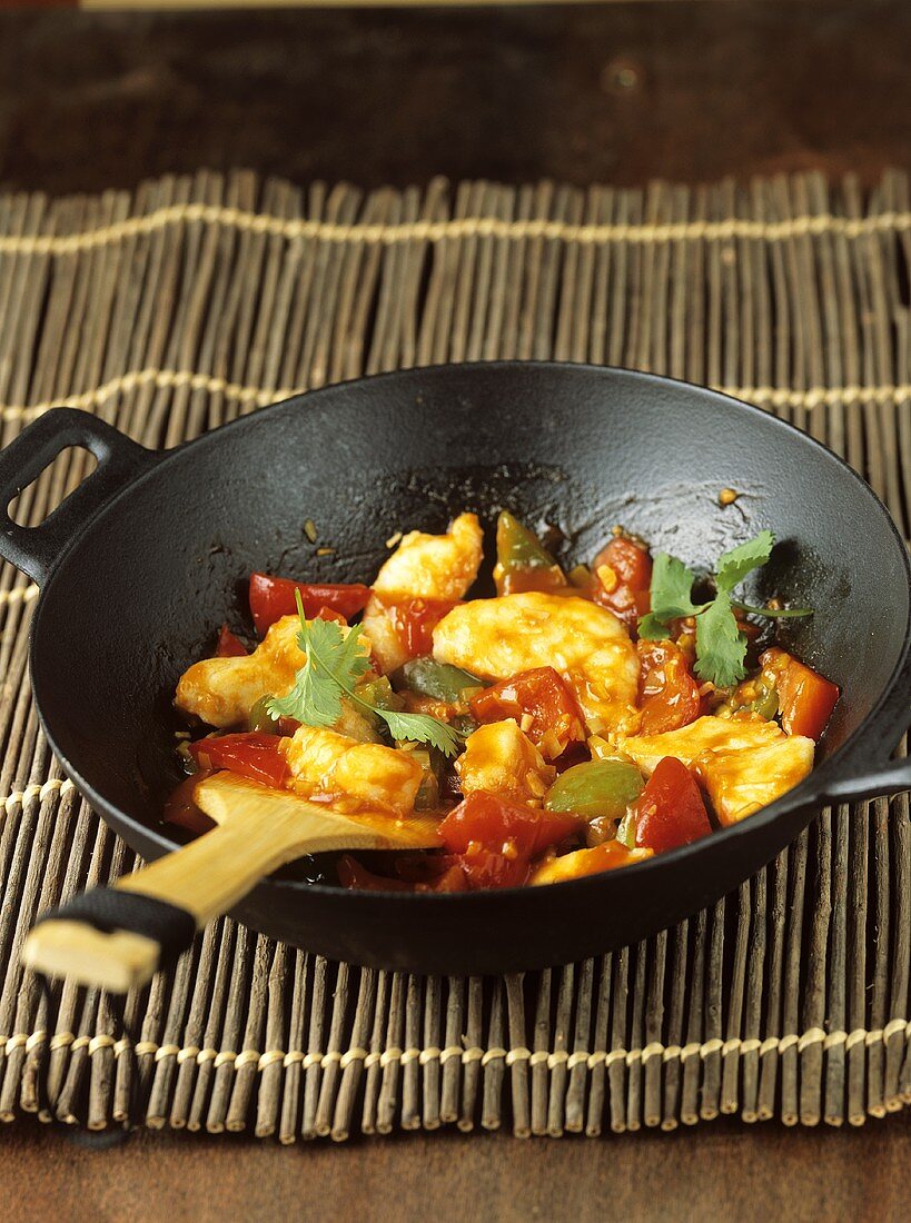 Chicken and peppers in wok