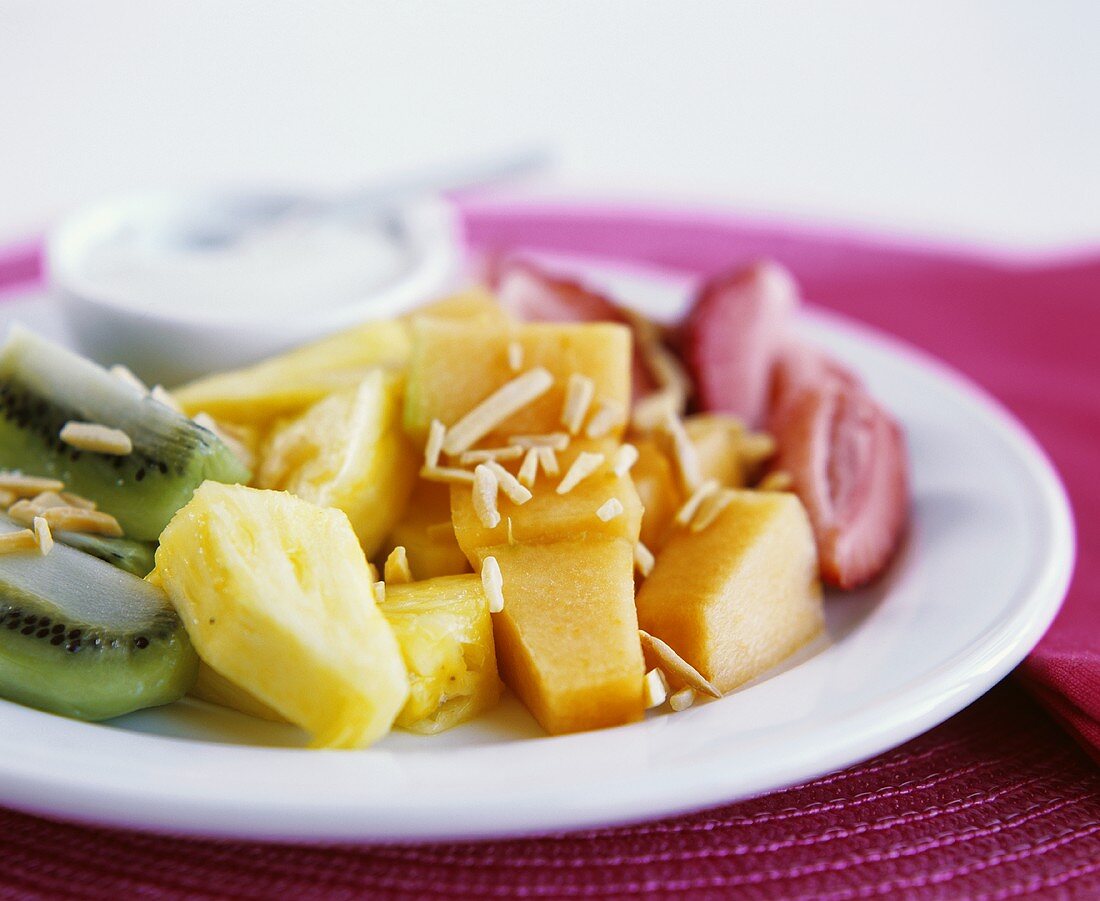Fruit salad with rum and almonds