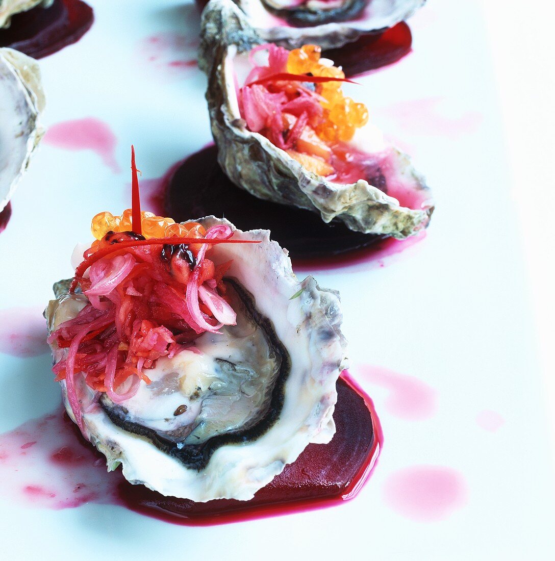 Oyster with tamarillo relish on beetroot