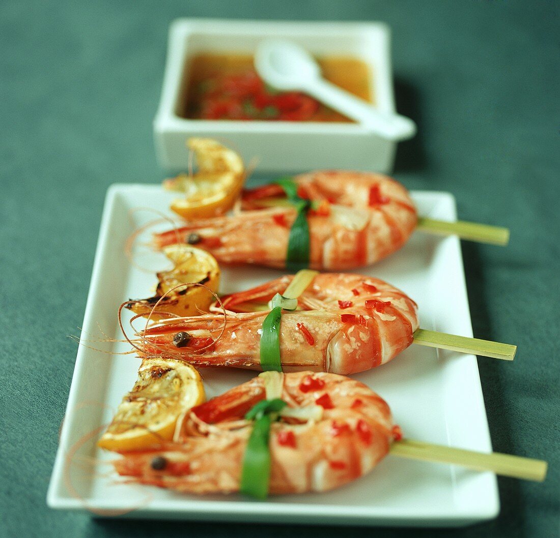 Caramelised prawn skewers with chilli and lemon