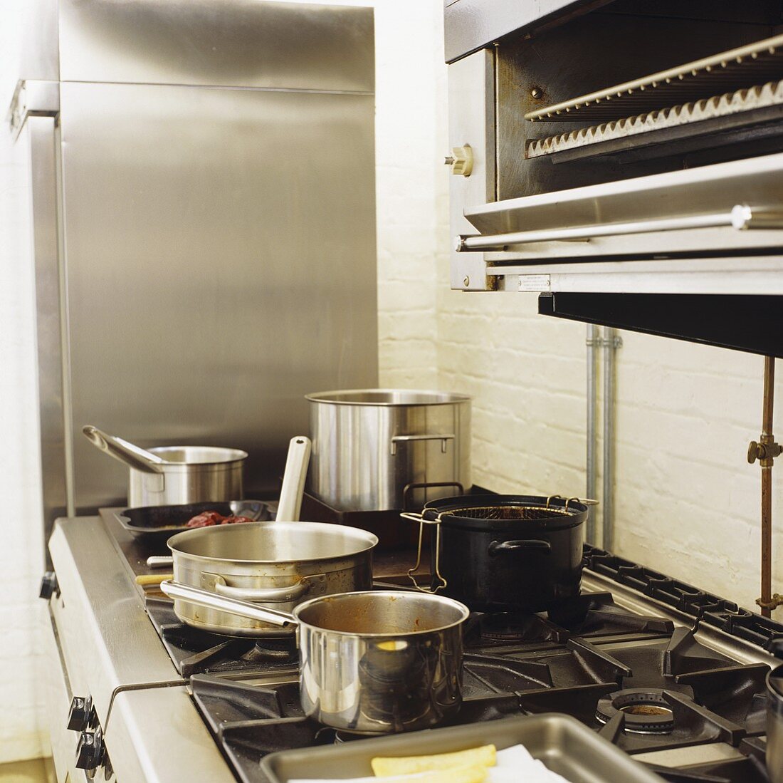 Assorted pans on a gas cooker