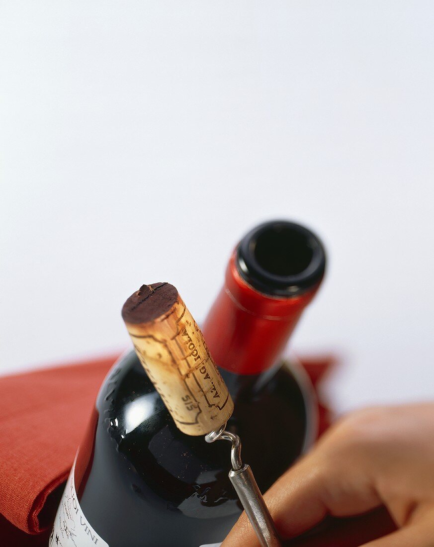 An uncorked bottle of red wine