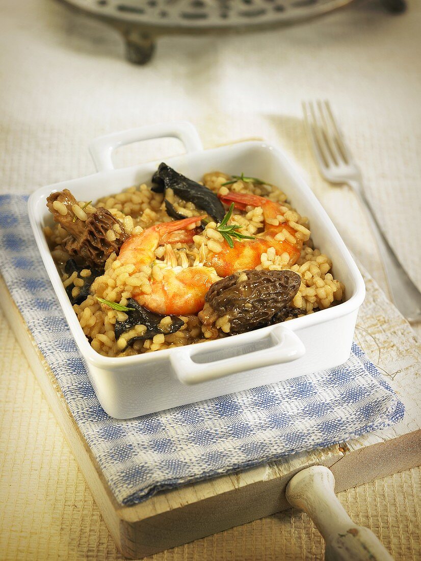 Arroz meloso (fried rice, Spain) with morels and king prawns