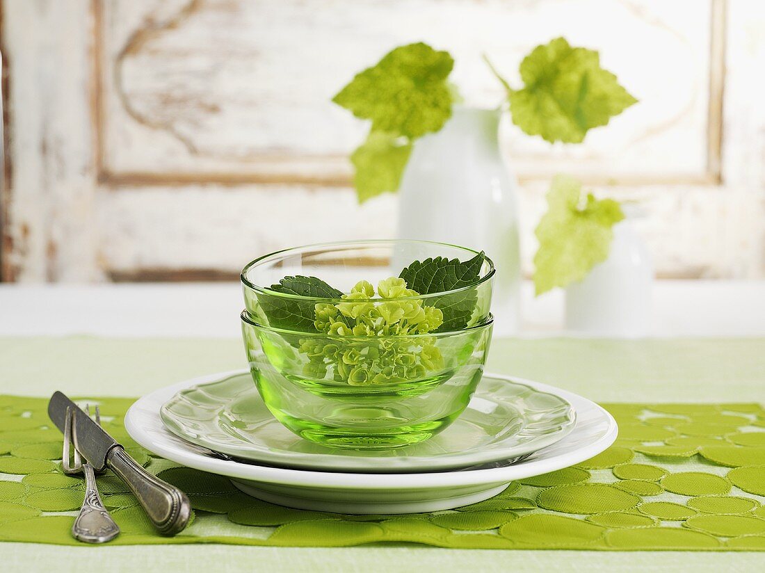 A place setting with flowers in a bowl