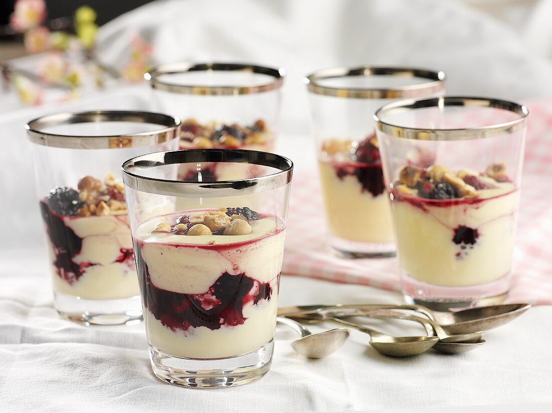 Cream desserts with nuts and berries