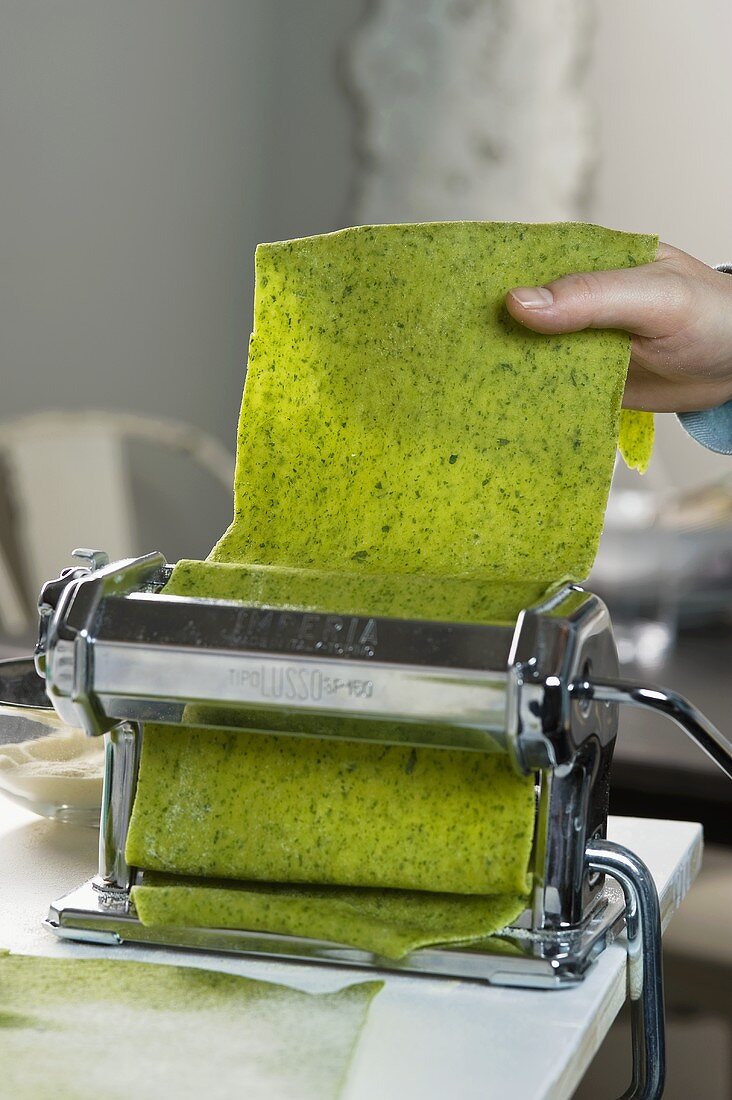 A pasta machine and dough for parsley ravioli