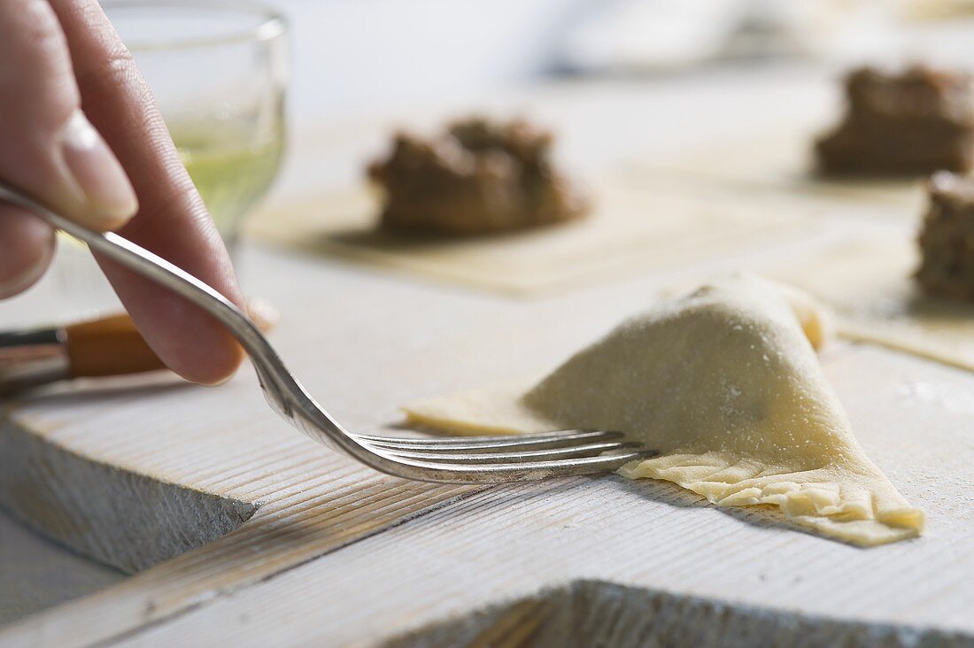 Ravioli with a braised meat filling being prepared
