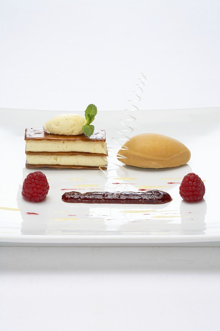 Vanilla mousse in strudel pastry with caramel ice cream and raspberry confit