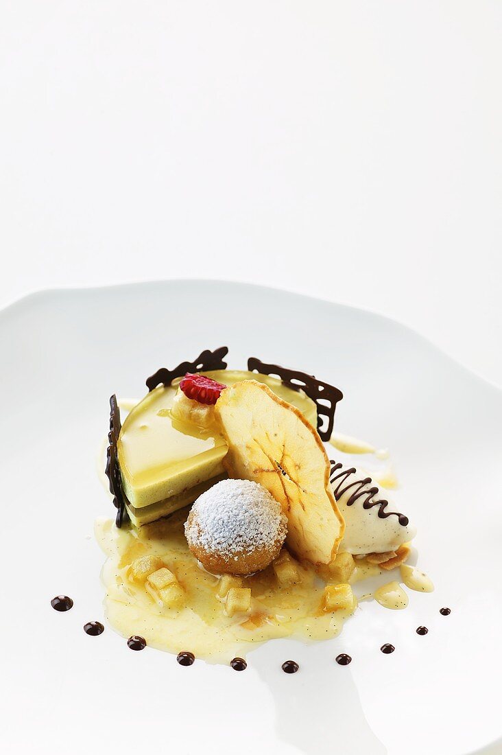 Apple mousse tartlet with Calvados jelly, apple ice cream and baked pralines