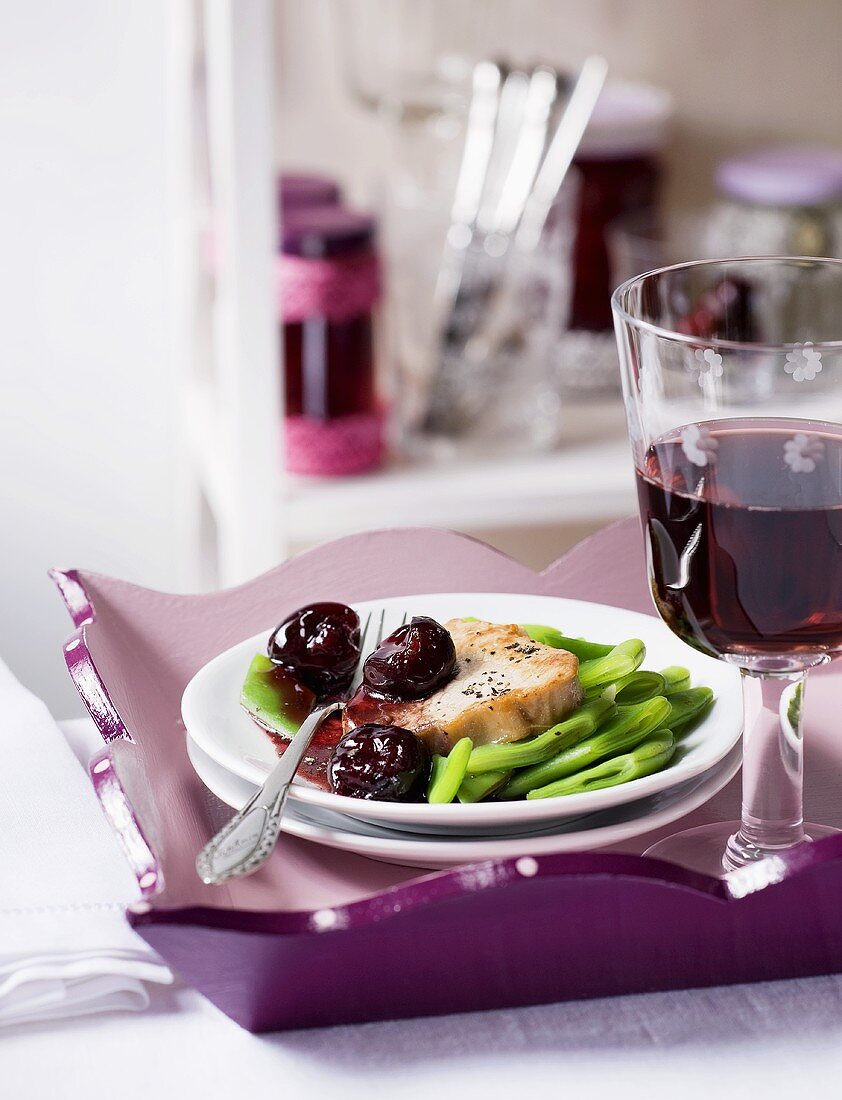 Veal steak with beans and cherry jam