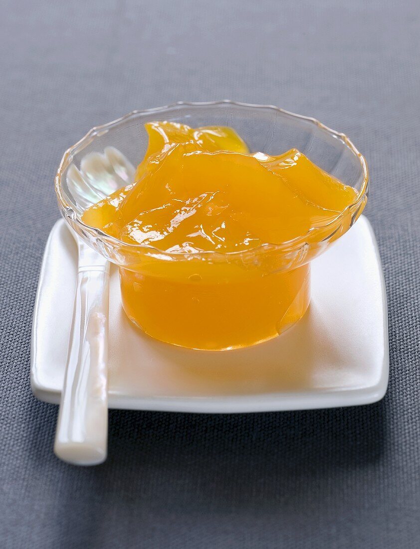 A small pot of mandarin jam