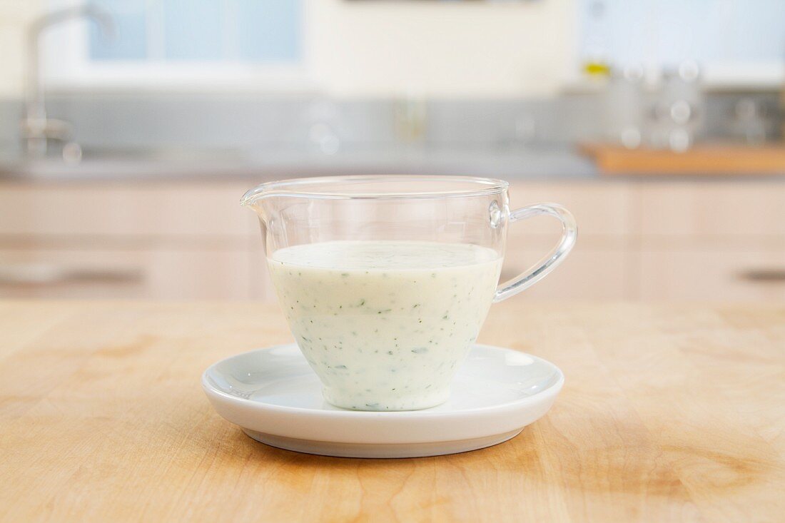 Yogurt dressing in a glass cup