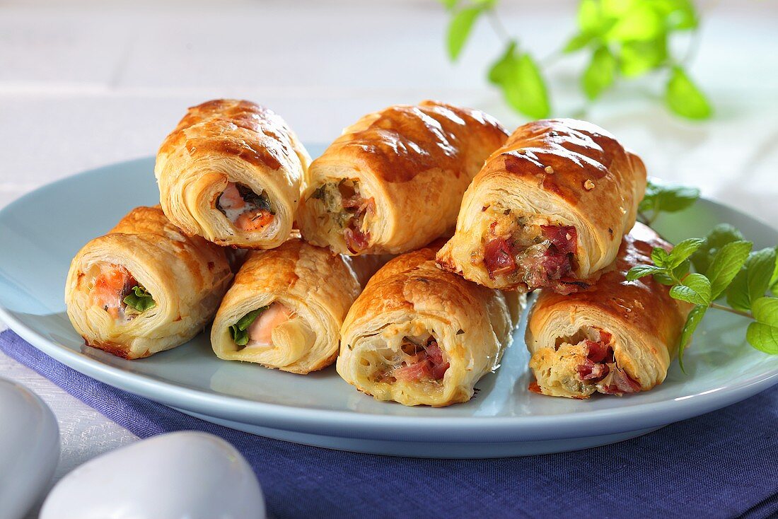 Puff pastry rolls with ham, cheese and salmon