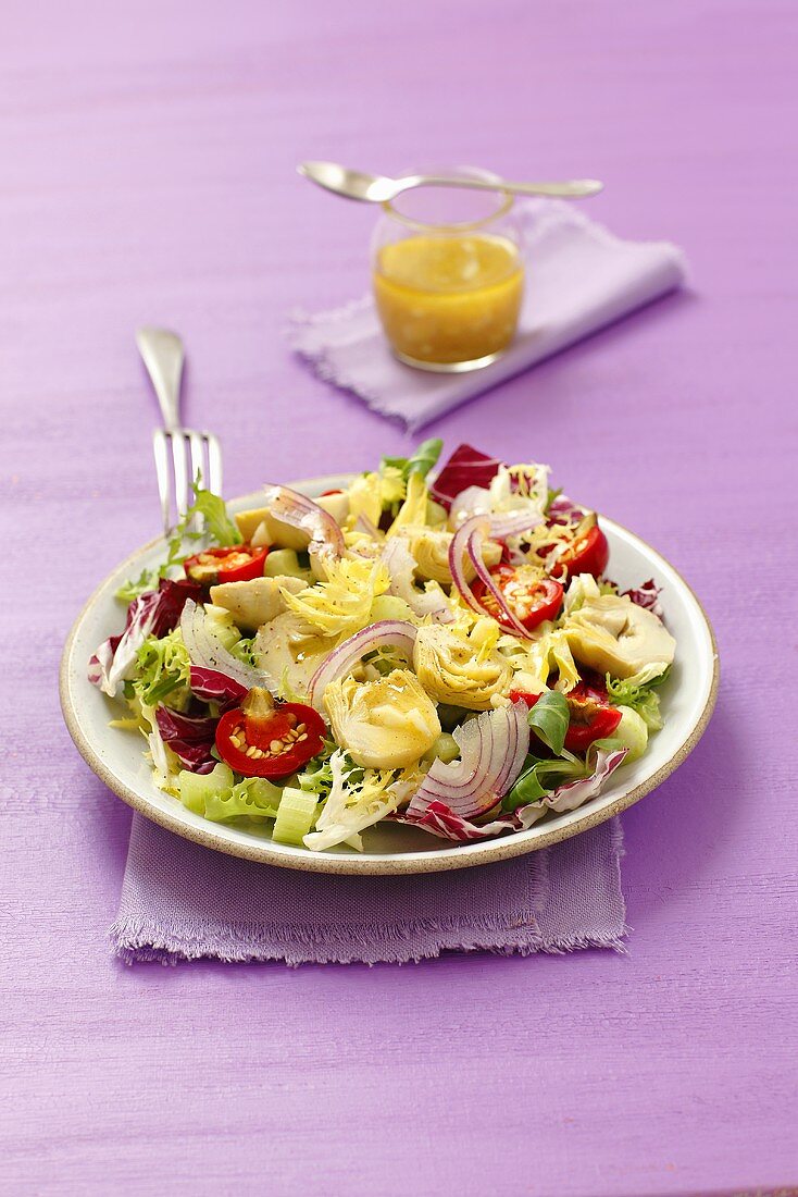 Salad with artichoke hearts, cherry peppers and onions with a garlic and mustard dressing
