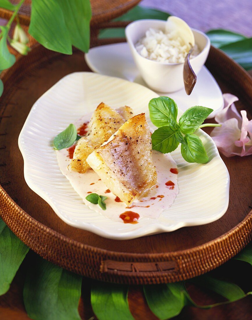 Redfish fillet with coconut sauce and basil