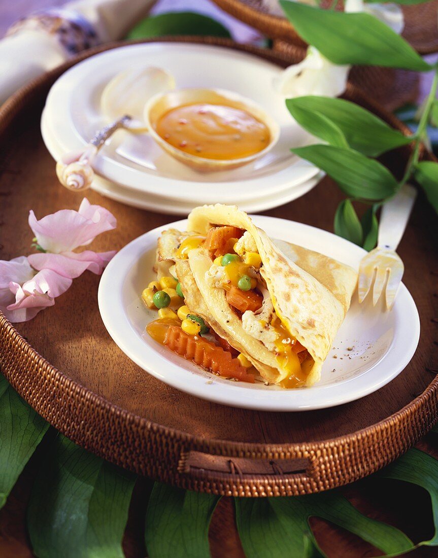 Pancake with vegetable filling and sweet and sour sauce