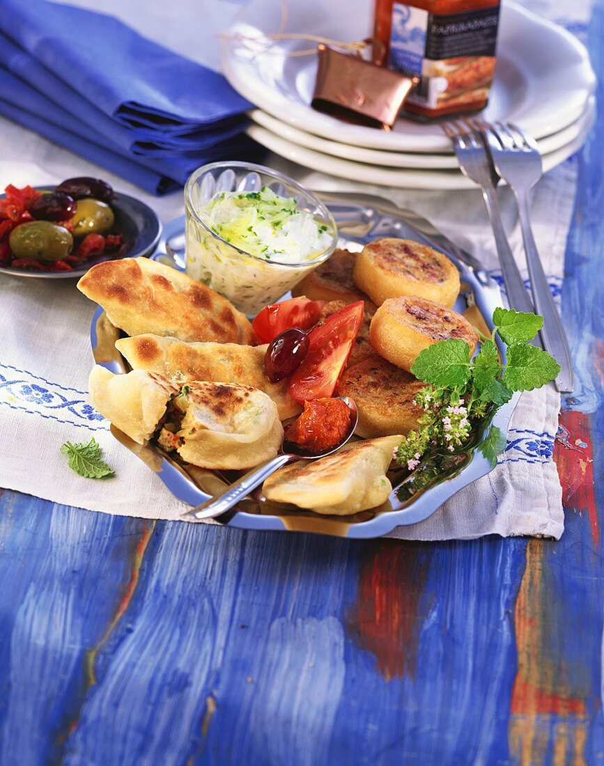 Soft cheese pasties, sultana keftedes and tzatziki