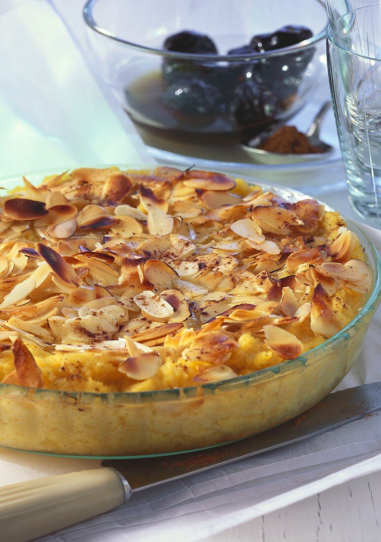 Polenta with almonds, served with bottled plums