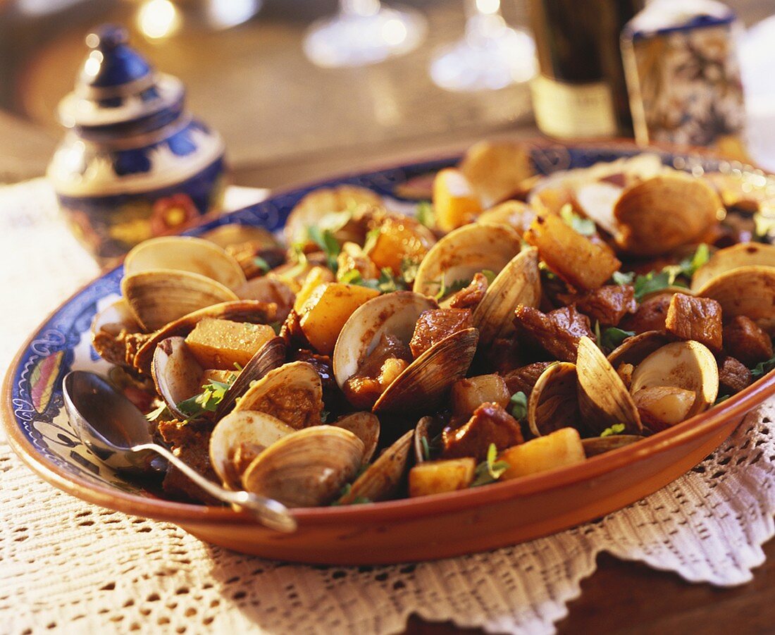 Clams with diced pork and potatoes (Portugal)