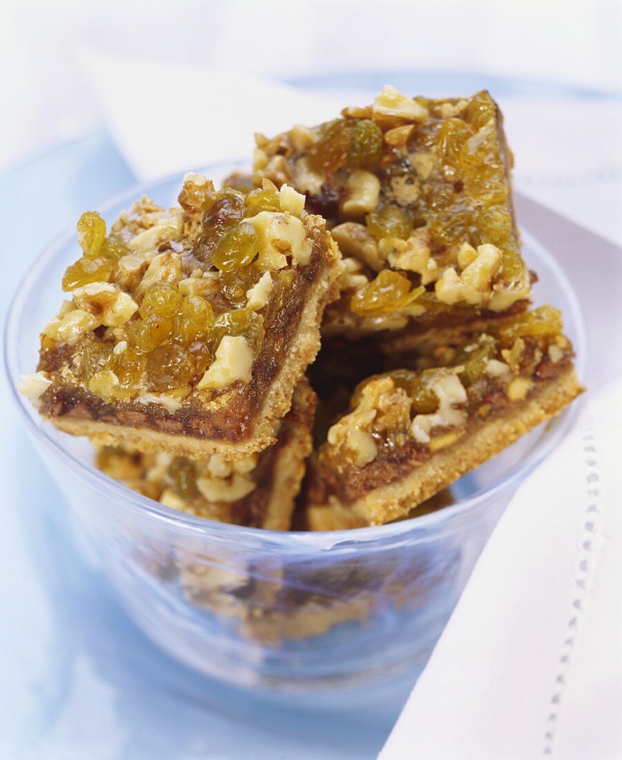 Caramel slices with walnuts, raisins and maple syrup