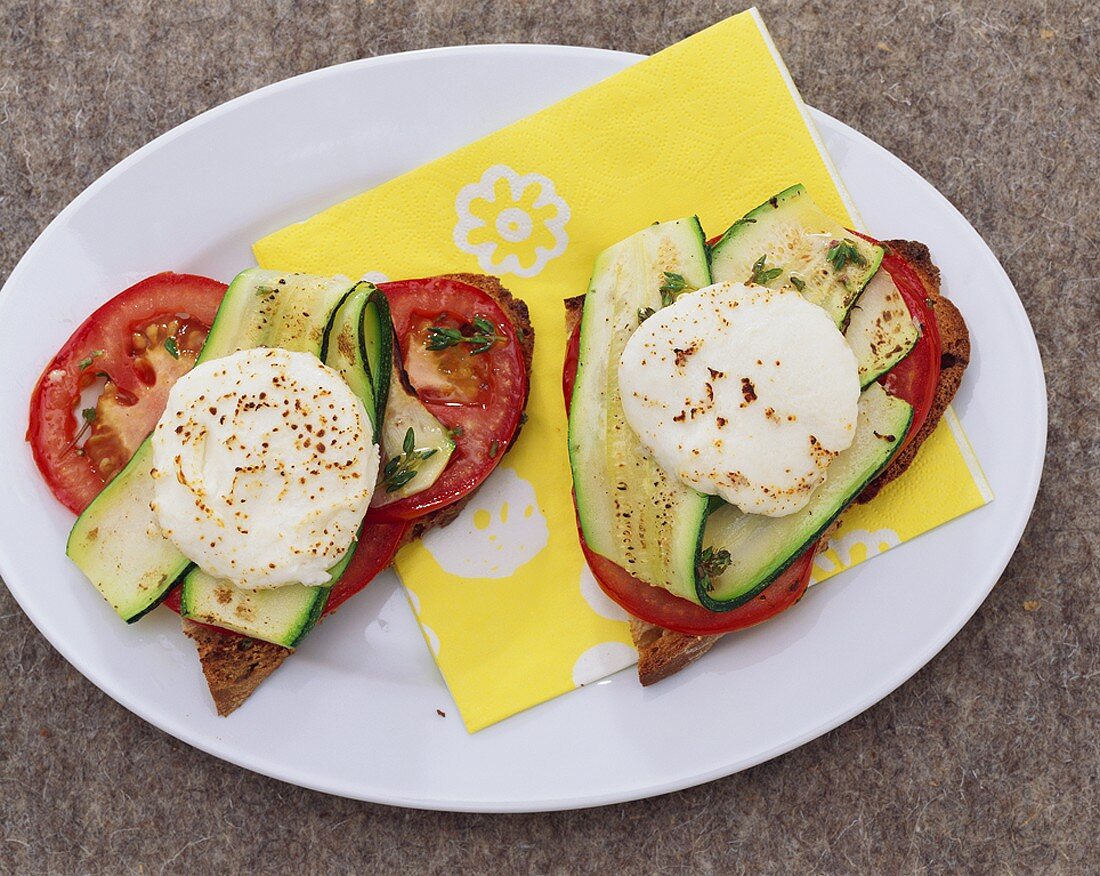 Courgettes, tomatoes and fresh goat's cheese on toast