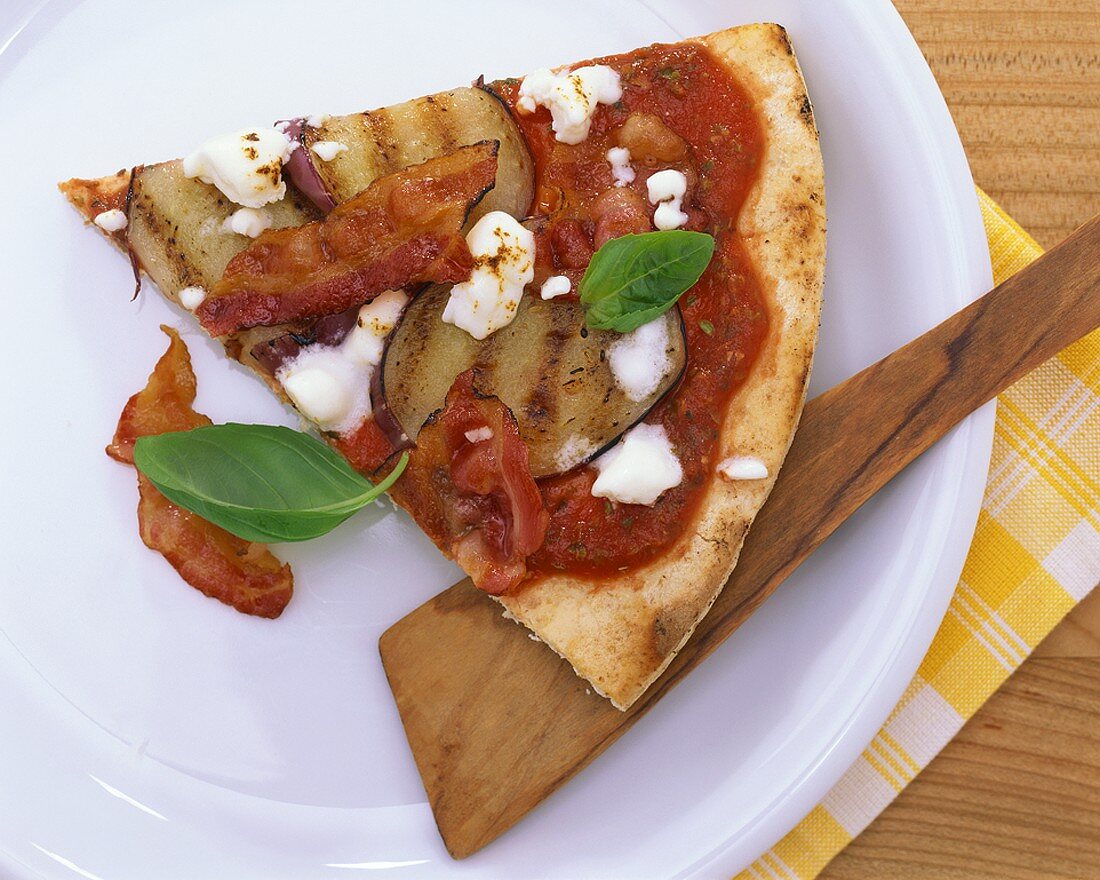 Pizza with aubergine, tomato and sheep's cheese topping